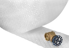 Bubble, Foam & Cushioning - Small valve laying on the edge of a roll of bubble wrap